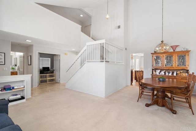 4356 Point Reyes Ct, Carlsbad, CA 92010 - dining space featuring a towering ceiling, stairway, carpet floors, recessed lighting, and a chandelier