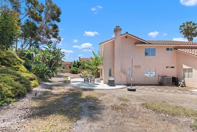 4356 Point Reyes Ct, Carlsbad, CA 92010 - back of property featuring a chimney, a patio, a tile roof, and stucco siding