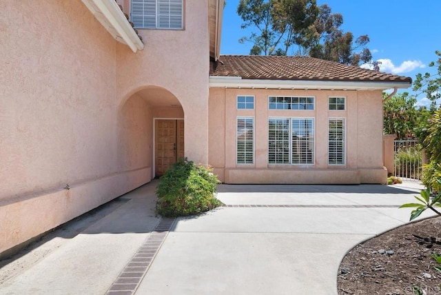 4356 Point Reyes Ct, Carlsbad, CA 92010 - entrance to property with a patio, stucco siding, and a tiled roof