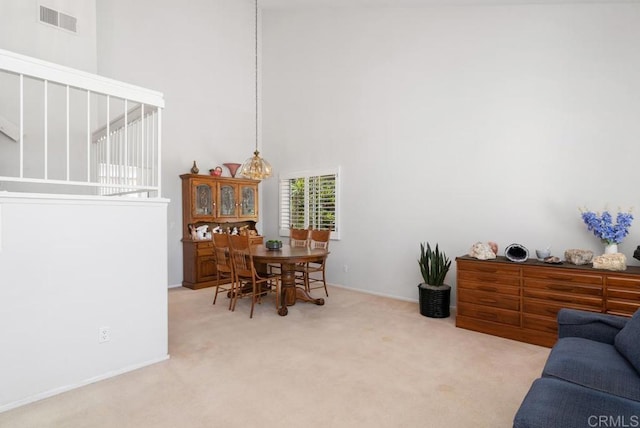 4356 Point Reyes Ct, Carlsbad, CA 92010 - carpeted dining room with a high ceiling and baseboards