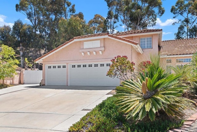 4356 Point Reyes Ct, Carlsbad, CA 92010 - mediterranean / spanish-style house with a garage, driveway, stucco siding, and a tile roof