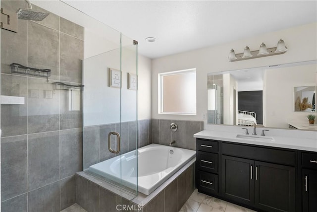 4443 Manzanita St, Guadalupe, CA 93434 - ensuite bathroom with vanity, tiled shower, a garden tub, and marble look tile flooring