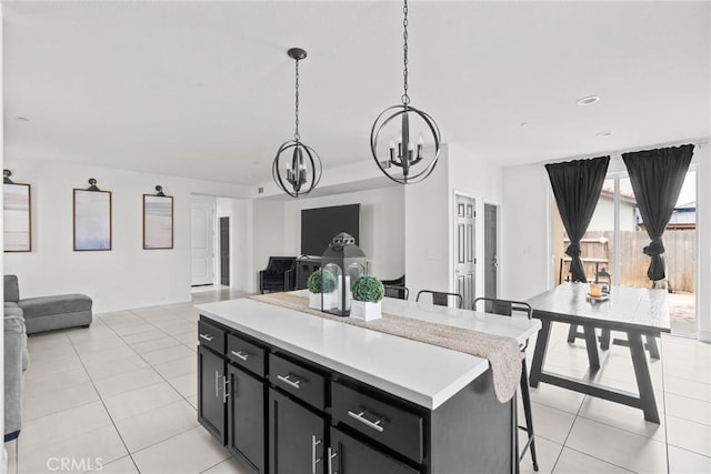 4443 Manzanita St, Guadalupe, CA 93434 - kitchen featuring open floor plan, a chandelier, and dark cabinets