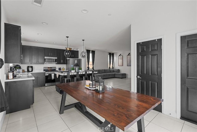 4443 Manzanita St, Guadalupe, CA 93434 - dining space with light tile patterned floors and recessed lighting