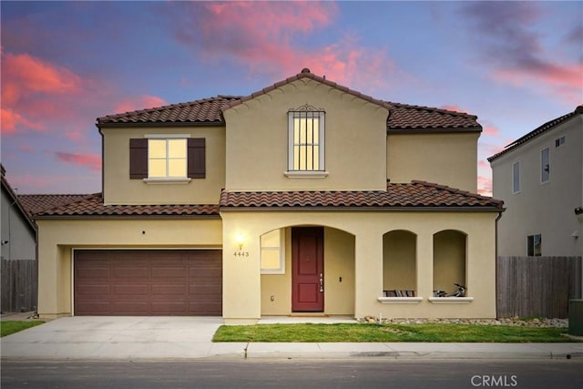 4443 Manzanita St, Guadalupe, CA 93434 - mediterranean / spanish home featuring a tiled roof, driveway, stucco siding, and a porch