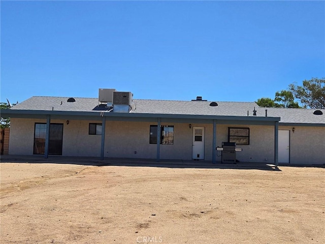 7050 Ivanpah Ave Unit 29, Palms, CA 92277 - rear view of property with stucco siding