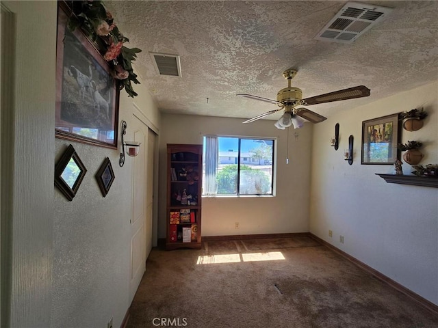 7050 Ivanpah Ave Unit 29, Palms, CA 92277 - unfurnished room featuring carpet, a ceiling fan, and a textured ceiling