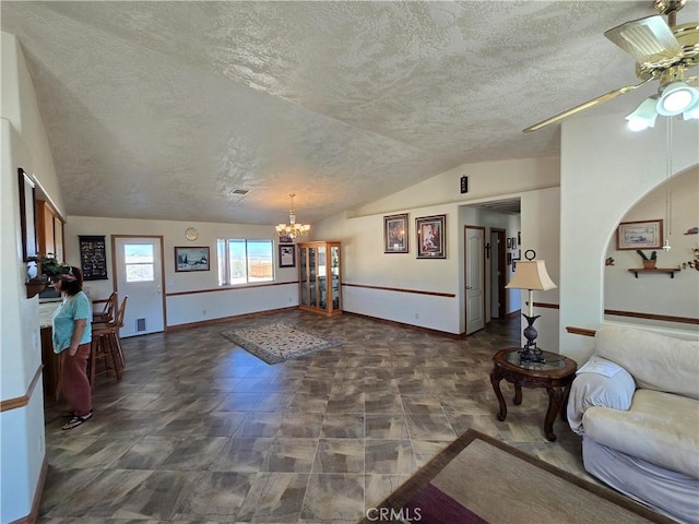 7050 Ivanpah Ave Unit 29, Palms, CA 92277 - living area with vaulted ceiling, a textured ceiling, a chandelier, and a ceiling fan