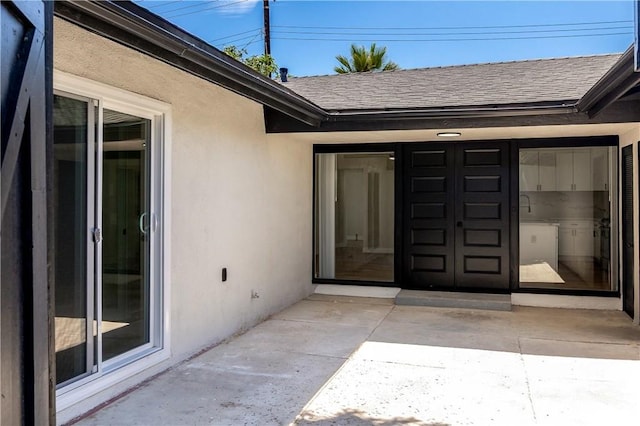 7364 Layton St, Rancho Cucamonga, CA 91730 - view of exterior entry with stucco siding and roof with shingles
