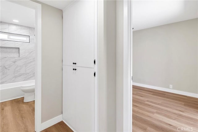 7364 Layton St, Rancho Cucamonga, CA 91730 - corridor with wood finished floors and baseboards