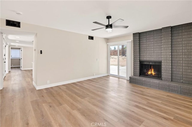 7364 Layton St, Rancho Cucamonga, CA 91730 - unfurnished living room featuring ceiling fan, a brick fireplace, and light wood finished floors