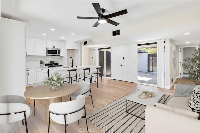 7364 Layton St, Rancho Cucamonga, CA 91730 - living room featuring light wood-type flooring, a ceiling fan, and recessed lighting