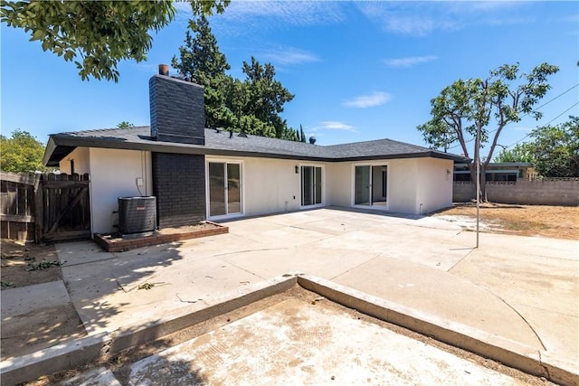 7364 Layton St, Rancho Cucamonga, CA 91730 - back of house featuring a chimney, stucco siding, a patio, and a shingled roof