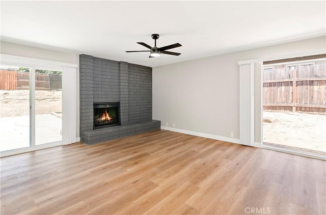 7364 Layton St, Rancho Cucamonga, CA 91730 - unfurnished living room with ceiling fan, a brick fireplace, and light wood-type flooring