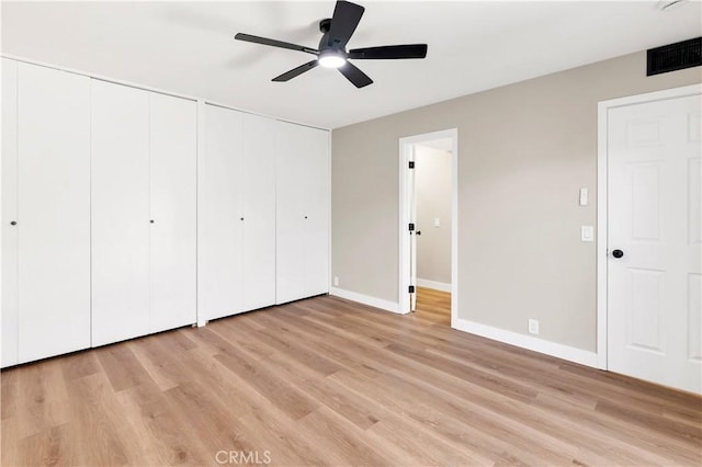 7364 Layton St, Rancho Cucamonga, CA 91730 - unfurnished bedroom featuring multiple closets, light wood-type flooring, and a ceiling fan