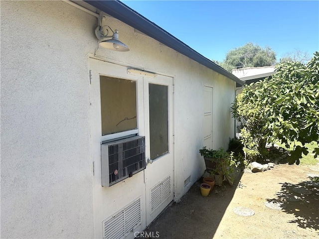 1316 Elm St, Alhambra, CA 91803 - view of exterior entry featuring stucco siding and cooling unit