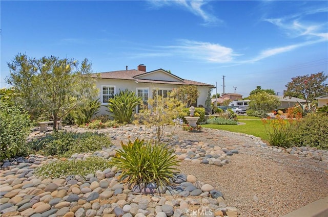 829 N Foxdale Ave, West Covina, CA 91790 - rear view of house with stucco siding and a chimney