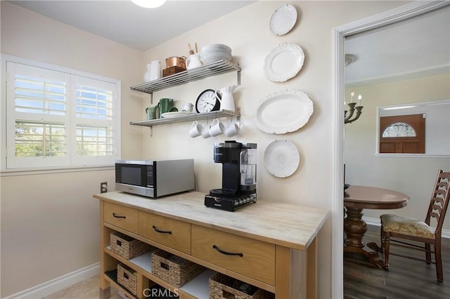 829 N Foxdale Ave, West Covina, CA 91790 - bar area featuring stainless steel microwave and baseboards