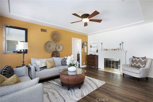 829 N Foxdale Ave, West Covina, CA 91790 - living area featuring a ceiling fan, wood finished floors, and a brick fireplace