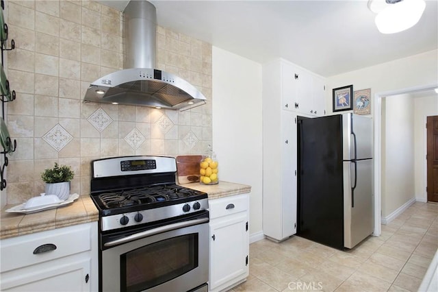 829 N Foxdale Ave, West Covina, CA 91790 - kitchen with appliances with stainless steel finishes, wall chimney range hood, decorative backsplash, light countertops, and white cabinetry