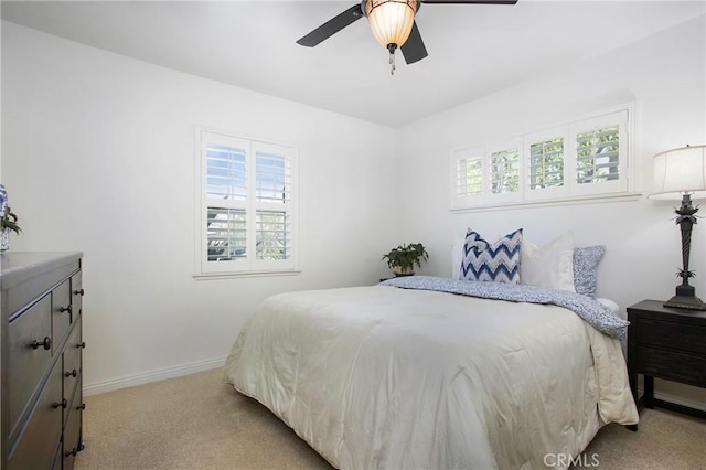 829 N Foxdale Ave, West Covina, CA 91790 - bedroom featuring multiple windows, light colored carpet, and a ceiling fan