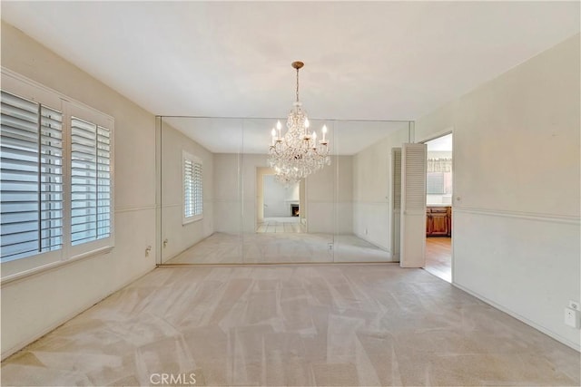 1318 Sao Paulo Ave, Placentia, CA 92870 - unfurnished dining area with a chandelier and light colored carpet