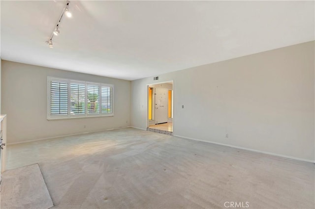 1318 Sao Paulo Ave, Placentia, CA 92870 - spare room featuring rail lighting and light carpet