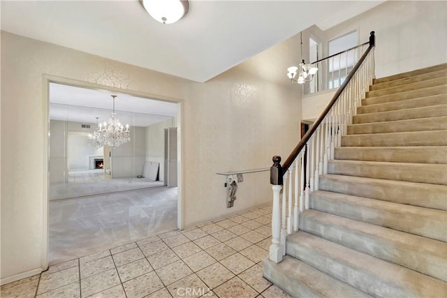 1318 Sao Paulo Ave, Placentia, CA 92870 - staircase with a chandelier, carpet, and tile patterned flooring