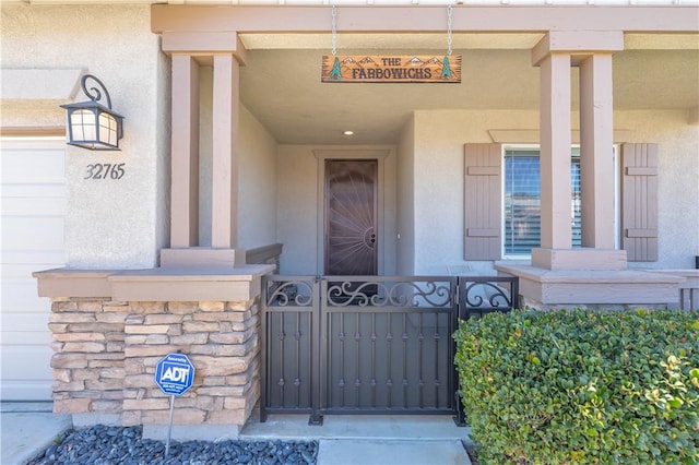 32765 Santa Cruz, Lake Elsinore, CA 92530 - entrance to property with stucco siding, a gate, and stone siding
