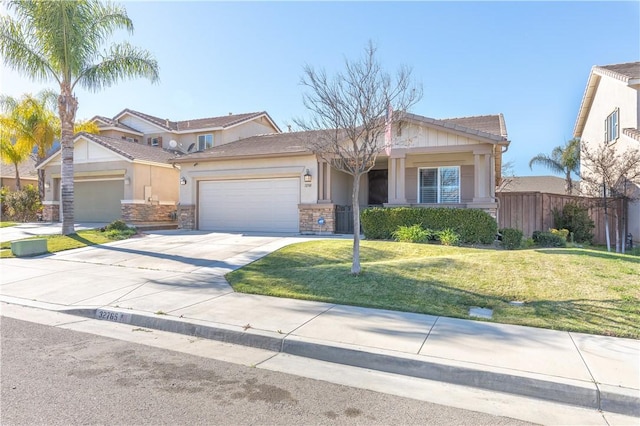 32765 Santa Cruz, Lake Elsinore, CA 92530 - view of front of house with an attached garage, driveway, stone siding, and stucco siding