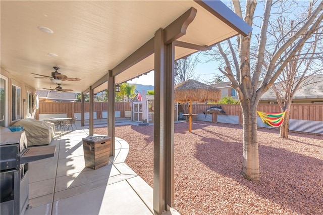 32765 Santa Cruz, Lake Elsinore, CA 92530 - fenced backyard with a storage shed, a patio, ceiling fan, and grilling area
