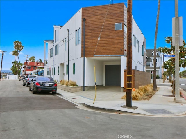 4405 Channel Pl, Newport Beach, CA 92663 - view of property featuring an attached garage