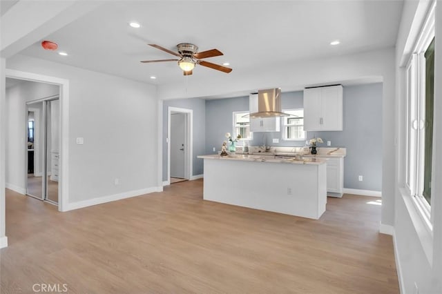 2049 W 71st St, Los Angeles, CA 90047 - kitchen with white cabinetry, recessed lighting, ceiling fan, light wood-style floors, and light countertops
