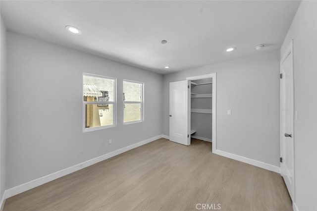 2049 W 71st St, Los Angeles, CA 90047 - unfurnished bedroom with light wood-type flooring and recessed lighting