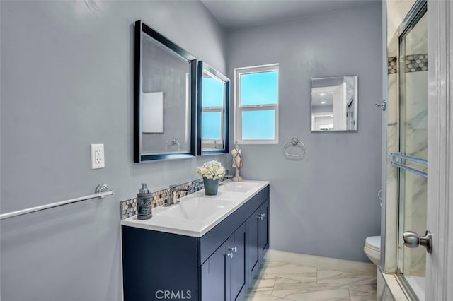 2049 W 71st St, Los Angeles, CA 90047 - bathroom with double vanity, a shower with door, and marble look tiles