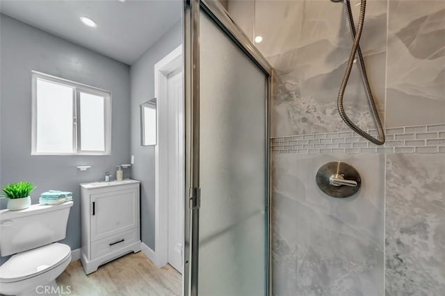 2049 W 71st St, Los Angeles, CA 90047 - full bath featuring a shower stall, vanity, and wood finished floors