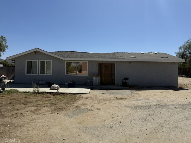 21981 Palm Ln, Perris, CA 92570 - back of property featuring stucco siding and a patio area