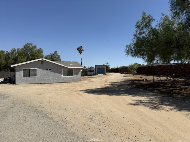 21981 Palm Ln, Perris, CA 92570 - view of front of property featuring stucco siding and driveway