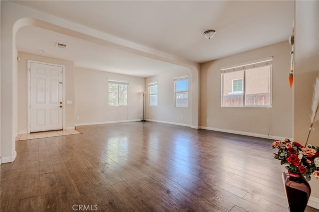 11818 Forest Park Ln, Victorville, CA 92392 - unfurnished room featuring arched walkways and wood finished floors