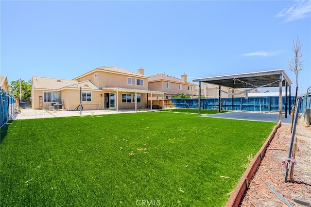 11818 Forest Park Ln, Victorville, CA 92392 - back of property featuring a fenced backyard, a patio, and stucco siding
