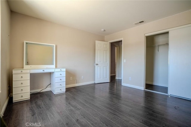 11818 Forest Park Ln, Victorville, CA 92392 - unfurnished bedroom featuring dark wood-style floors and a closet