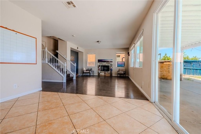 11818 Forest Park Ln, Victorville, CA 92392 - living area with stairway, healthy amount of natural light, and tile patterned floors