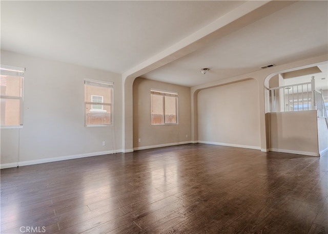 11818 Forest Park Ln, Victorville, CA 92392 - unfurnished room featuring arched walkways and dark wood finished floors