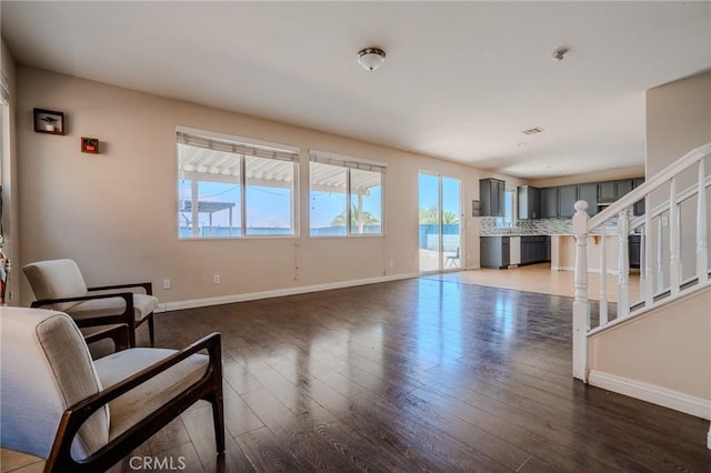 11818 Forest Park Ln, Victorville, CA 92392 - sitting room featuring light wood-style flooring and stairway