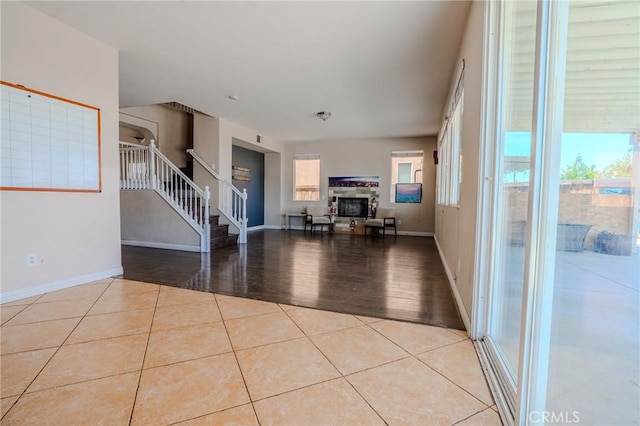 11818 Forest Park Ln, Victorville, CA 92392 - tiled living area featuring stairs and a stone fireplace