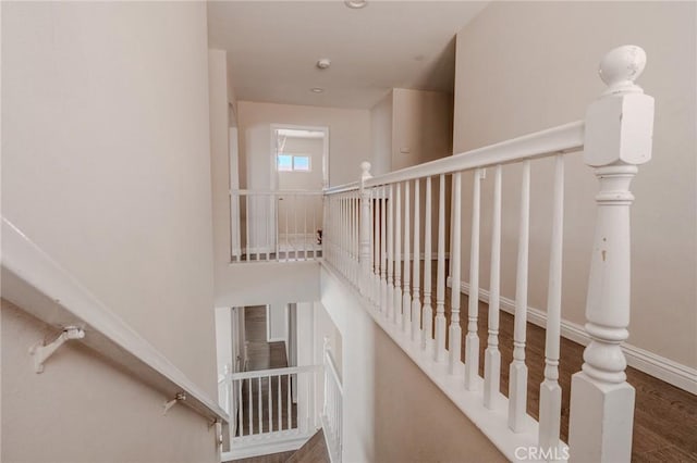 11818 Forest Park Ln, Victorville, CA 92392 - stairway featuring baseboards and wood finished floors
