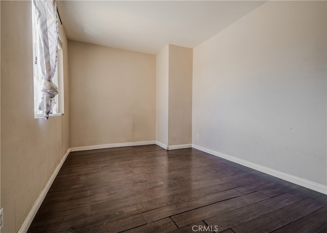 11818 Forest Park Ln, Victorville, CA 92392 - empty room featuring dark wood-style floors and baseboards