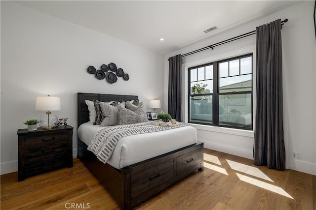 3325 Sagewood Hills Rd, Vista, CA 92084 - bedroom featuring light wood-style flooring and recessed lighting