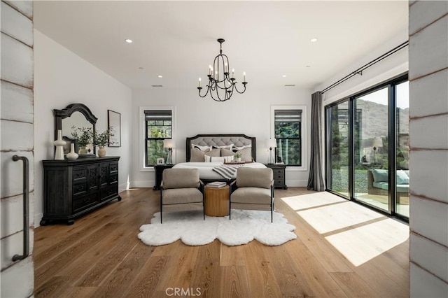 3325 Sagewood Hills Rd, Vista, CA 92084 - bedroom with access to outside, multiple windows, wood finished floors, a chandelier, and recessed lighting