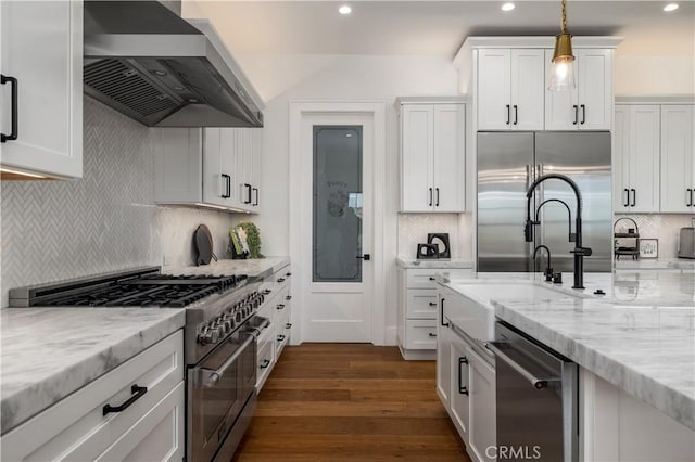3325 Sagewood Hills Rd, Vista, CA 92084 - kitchen featuring wall chimney exhaust hood, high end appliances, decorative backsplash, dark wood finished floors, and white cabinets